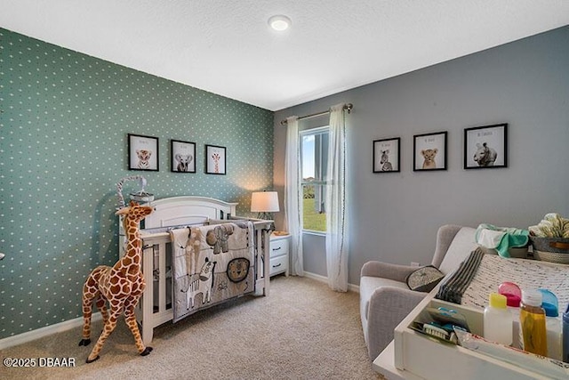 bedroom featuring a textured ceiling and light colored carpet