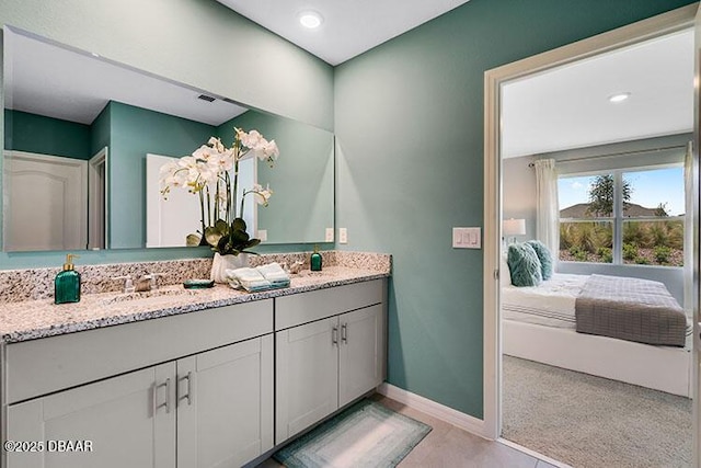 bathroom featuring tile patterned floors and vanity