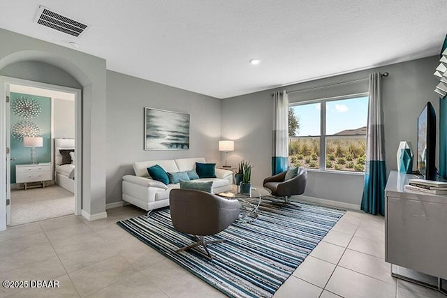 living room with light tile patterned floors