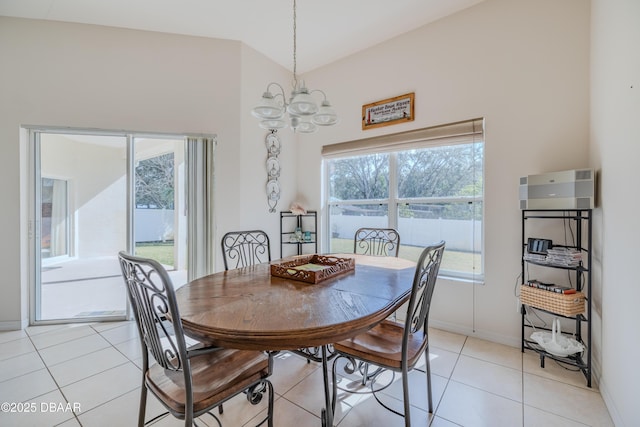 tiled dining area with an inviting chandelier and plenty of natural light