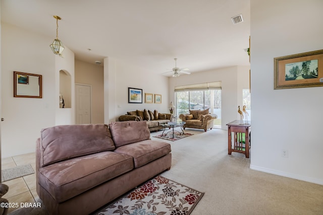 living room featuring light colored carpet and ceiling fan