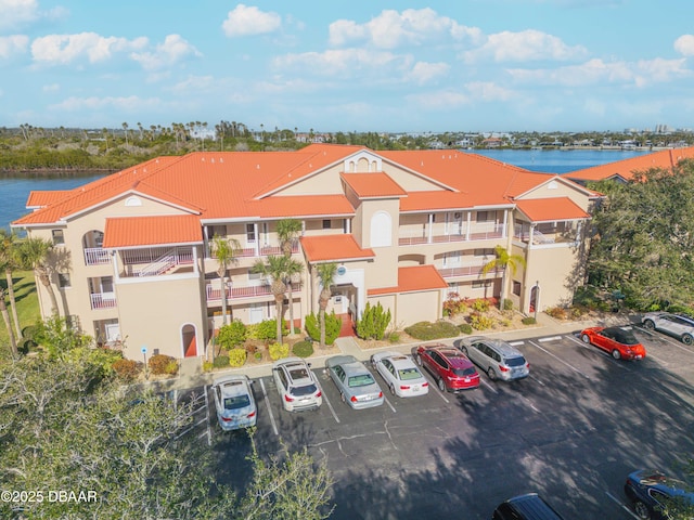 460 Bouchelle Dr Unit 104, New Smyrna Beach, FL 32169 - view of property with a water view and uncovered parking