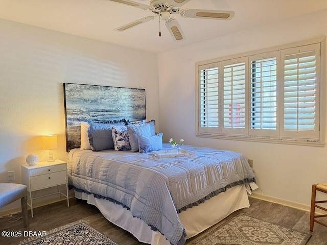 460 Bouchelle Dr Unit 104, New Smyrna Beach, FL 32169 - bedroom featuring baseboards, a ceiling fan, and wood finished floors