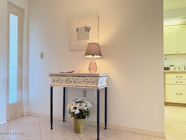 460 Bouchelle Dr Unit 104, New Smyrna Beach, FL 32169 - hall with baseboards and light tile patterned floors