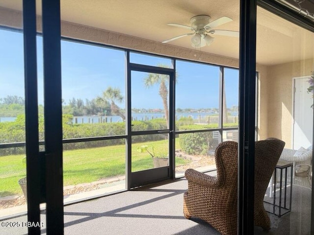 460 Bouchelle Dr Unit 104, New Smyrna Beach, FL 32169 - sunroom / solarium with a ceiling fan, a healthy amount of sunlight, and a water view