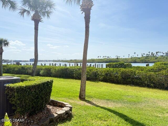 460 Bouchelle Dr Unit 104, New Smyrna Beach, FL 32169 - view of yard with a water view and cooling unit