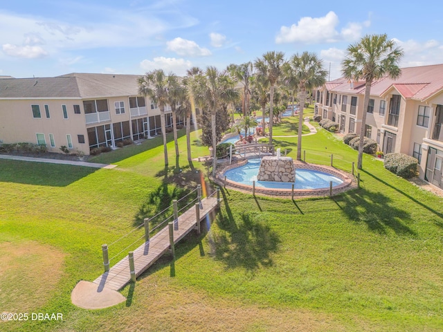 460 Bouchelle Dr Unit 104, New Smyrna Beach, FL 32169 - view of community featuring a yard