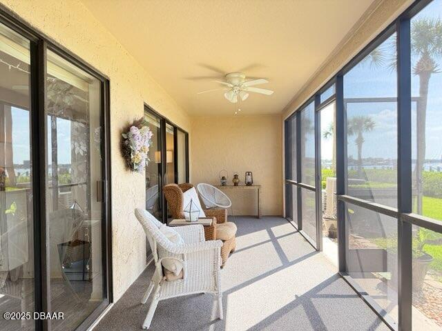 460 Bouchelle Dr Unit 104, New Smyrna Beach, FL 32169 - sunroom / solarium featuring ceiling fan and a healthy amount of sunlight