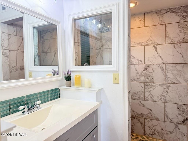 460 Bouchelle Dr Unit 104, New Smyrna Beach, FL 32169 - bathroom featuring vanity and tiled shower