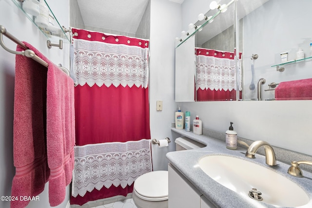 bathroom featuring a shower with shower curtain, vanity, and toilet