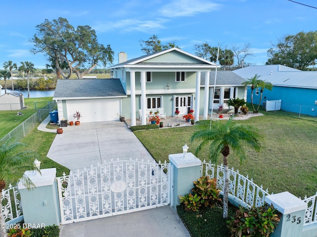 view of front of property with a garage and a front yard