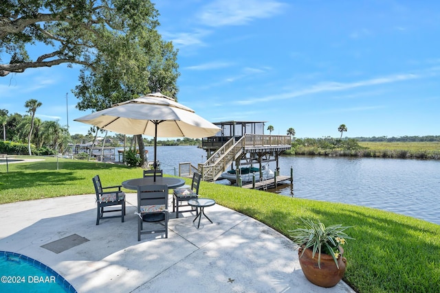 view of patio featuring a boat dock and a water view