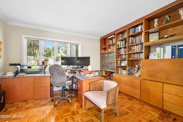 office area with crown molding and light parquet flooring