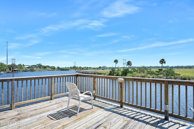 dock area with a deck with water view