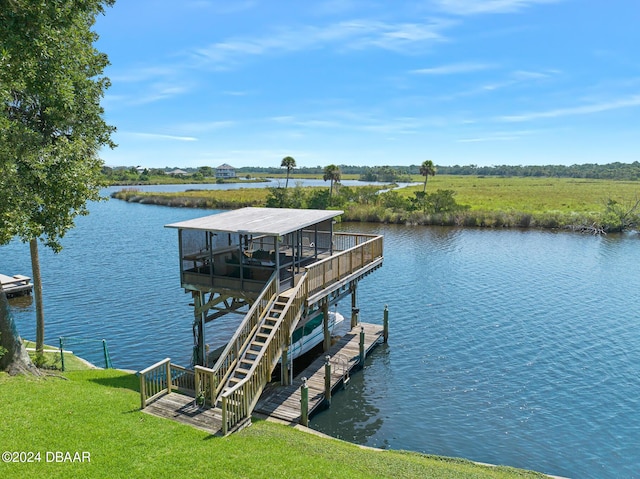 dock area featuring a yard and a water view