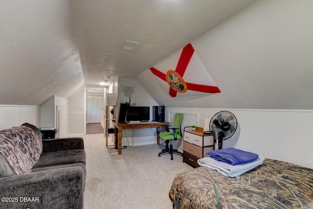 bedroom featuring carpet floors, visible vents, and vaulted ceiling