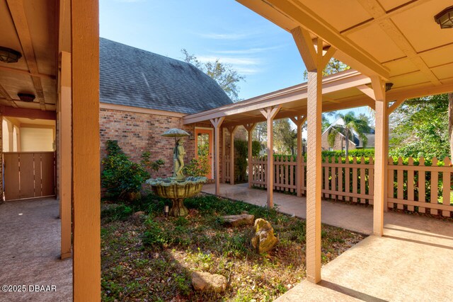 view of yard featuring a patio area and fence