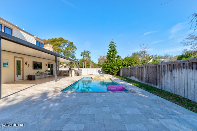 view of swimming pool with a patio area, a fenced backyard, a fenced in pool, and an in ground hot tub