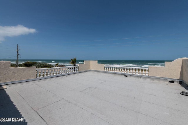 view of patio with a water view