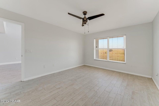 unfurnished room with ceiling fan and light hardwood / wood-style flooring