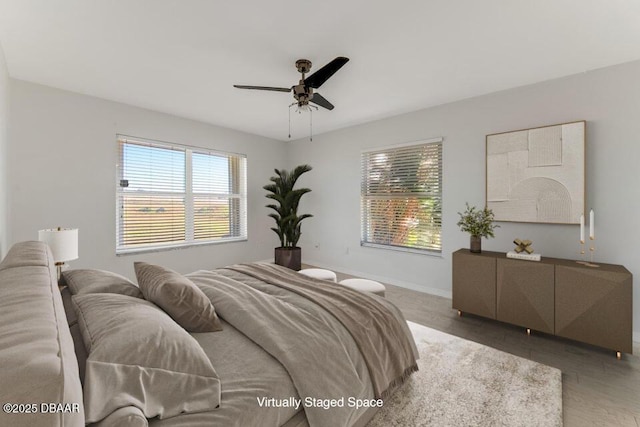 bedroom featuring ceiling fan and hardwood / wood-style floors