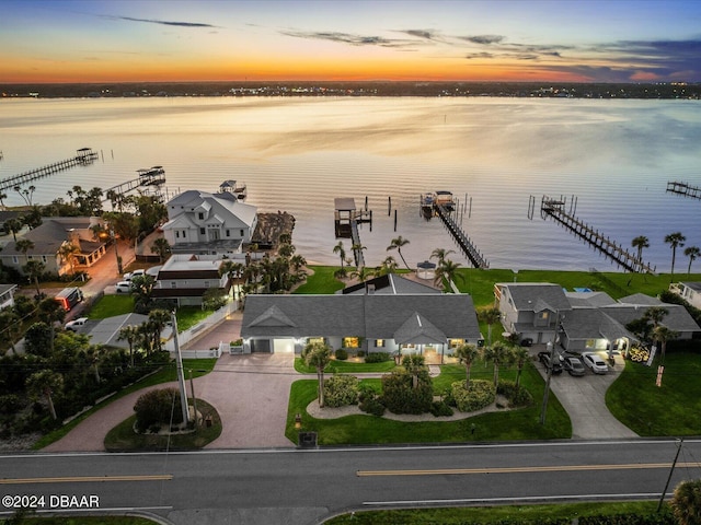 aerial view at dusk with a water view