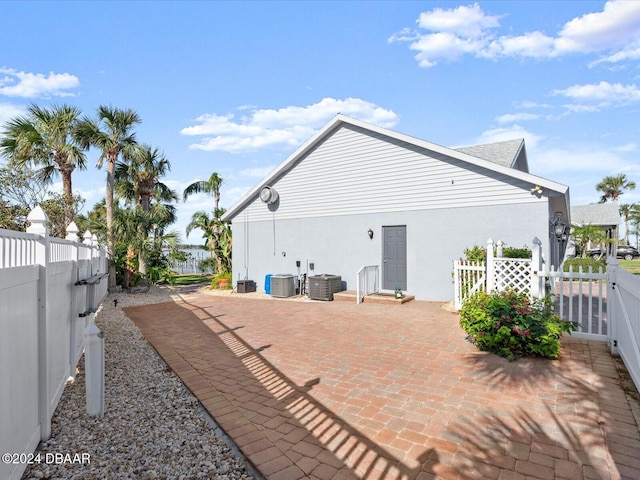 back of property with central AC unit