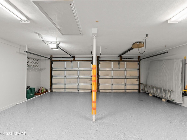 garage featuring a garage door opener