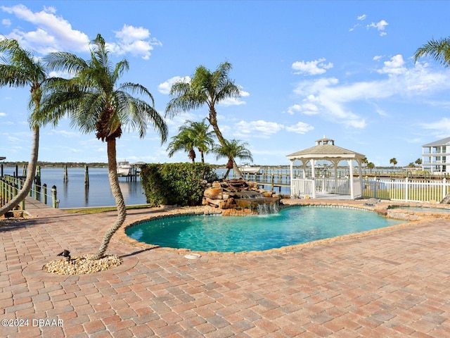 view of swimming pool featuring a gazebo, a water view, and a patio