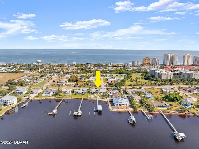 birds eye view of property featuring a water view