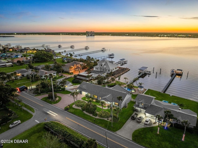 aerial view at dusk with a water view