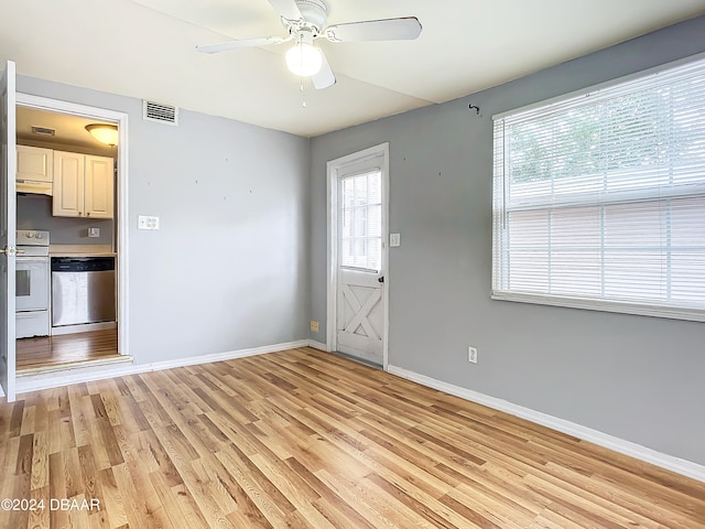 interior space with light wood-type flooring, a healthy amount of sunlight, and ceiling fan