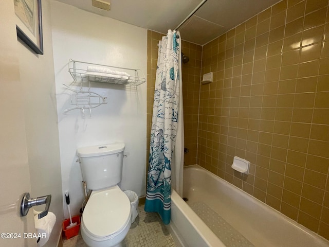 bathroom with shower / tub combo with curtain, toilet, and tile patterned flooring