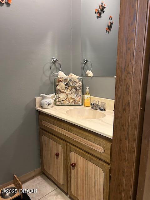 bathroom featuring tile patterned floors, vanity, and baseboards