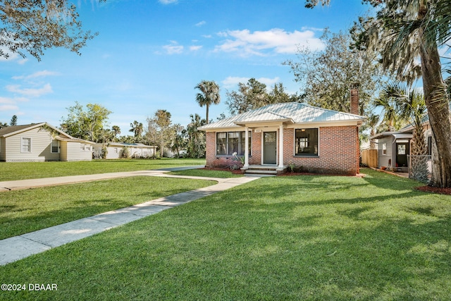 view of front of house with a front lawn