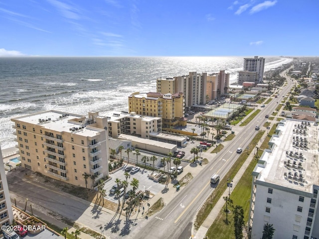 drone / aerial view featuring a view of city and a water view