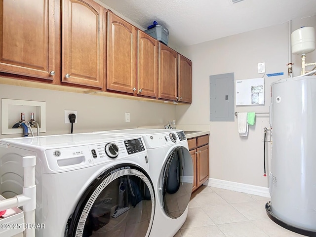 laundry area featuring electric panel, washing machine and dryer, water heater, cabinet space, and light tile patterned floors