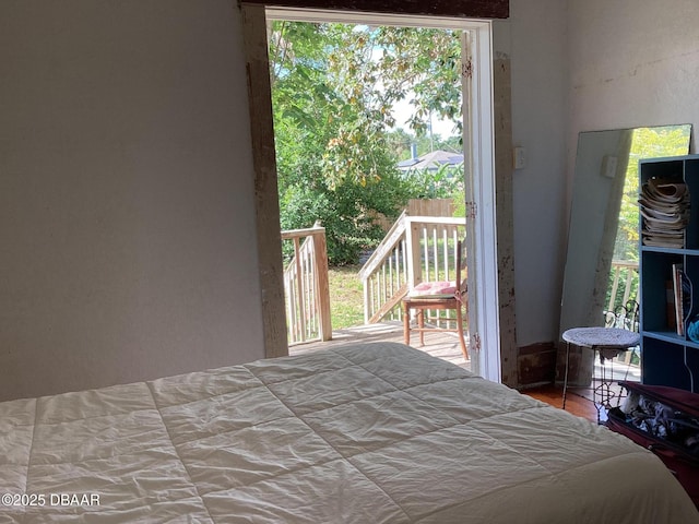 268 Hartford Ave, Daytona Beach, FL 32118 - bedroom with access to exterior and wood finished floors