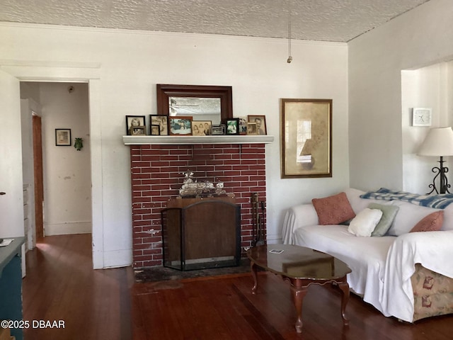 268 Hartford Ave, Daytona Beach, FL 32118 - living area featuring a fireplace, baseboards, wood finished floors, and a textured ceiling