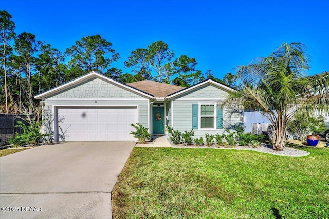 ranch-style house featuring a garage and a front yard