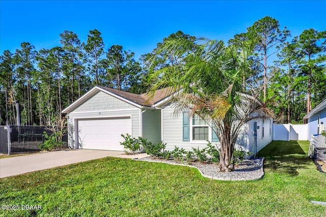 view of front of property with a garage and a front lawn