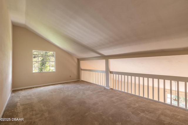 bonus room featuring carpet flooring and lofted ceiling