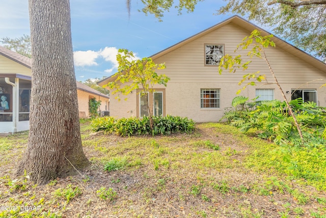 back of house featuring a sunroom