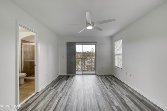 spare room featuring hardwood / wood-style flooring and ceiling fan