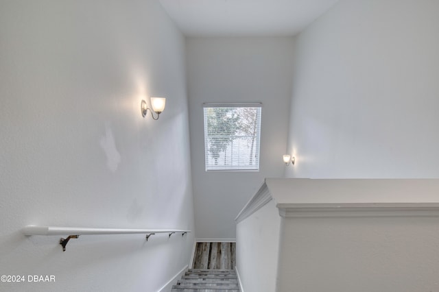 stairs with hardwood / wood-style floors