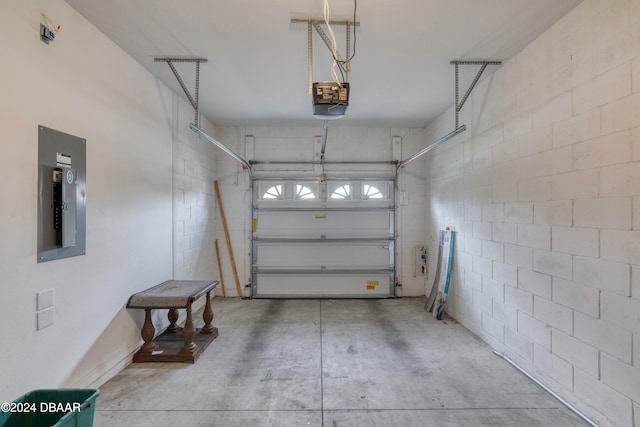 garage featuring electric panel and a garage door opener