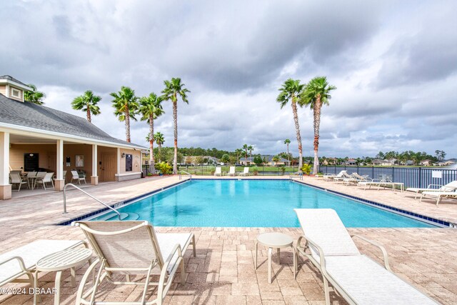 view of swimming pool with a patio