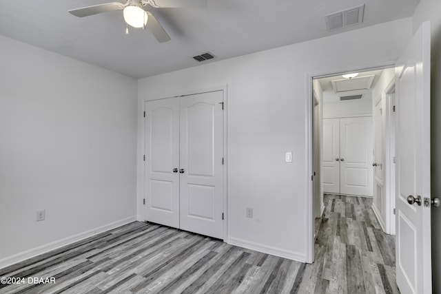 123 Langston Dr, Daytona Beach, FL 32124 - unfurnished bedroom featuring wood finished floors, a closet, baseboards, and ceiling fan