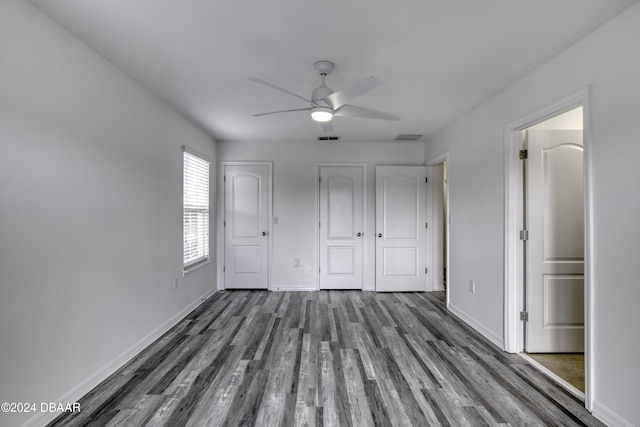 123 Langston Dr, Daytona Beach, FL 32124 - unfurnished bedroom featuring wood finished floors, baseboards, and ceiling fan