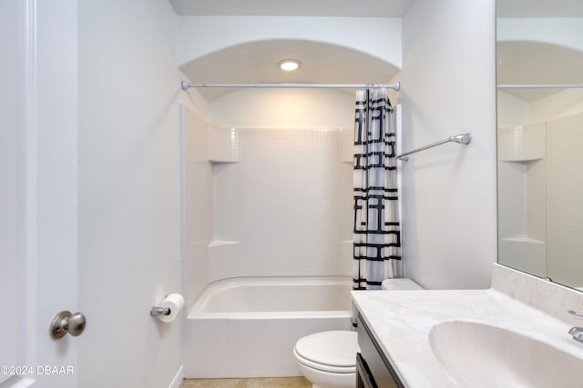 full bathroom with toilet, shower / bath combo, vanity, and tile patterned floors